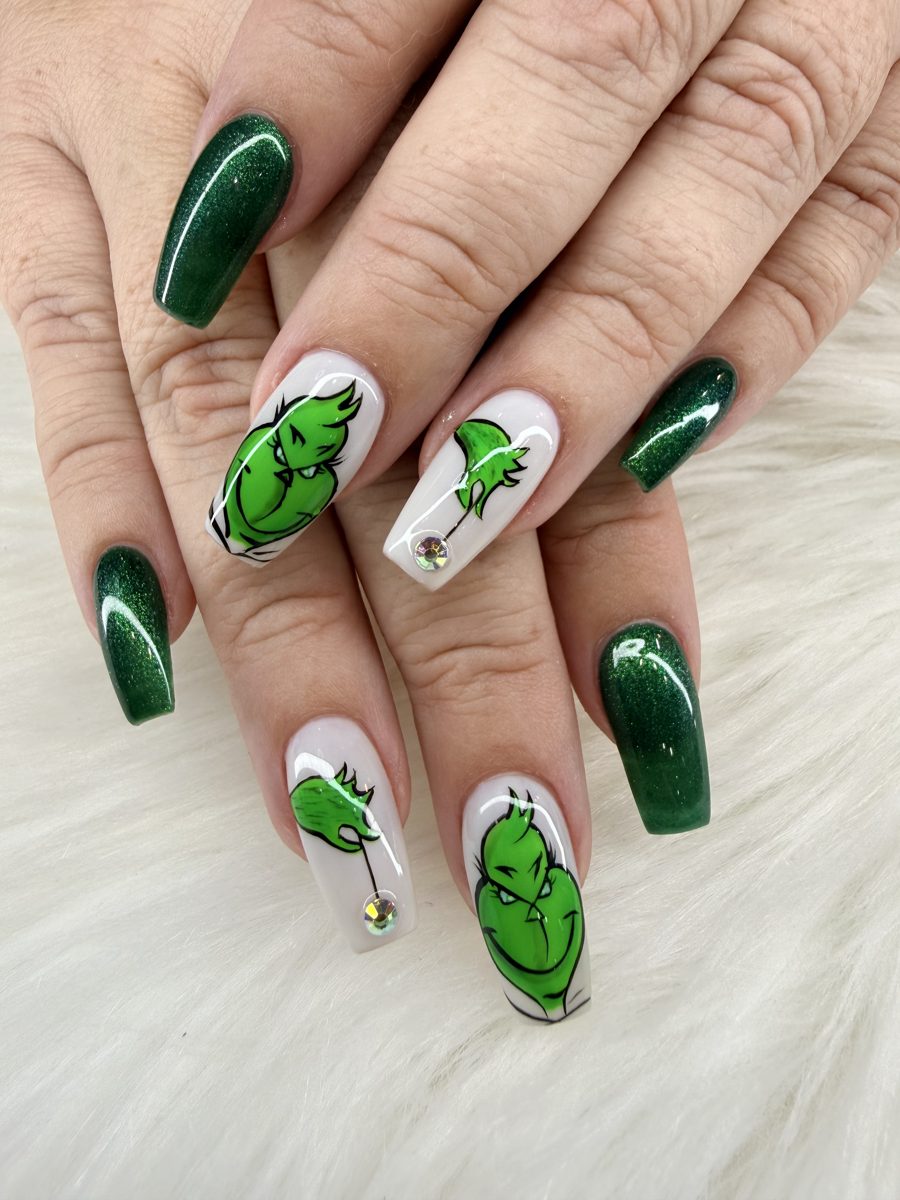 Emerald green and white square nails with hand-painted Grinch holiday art