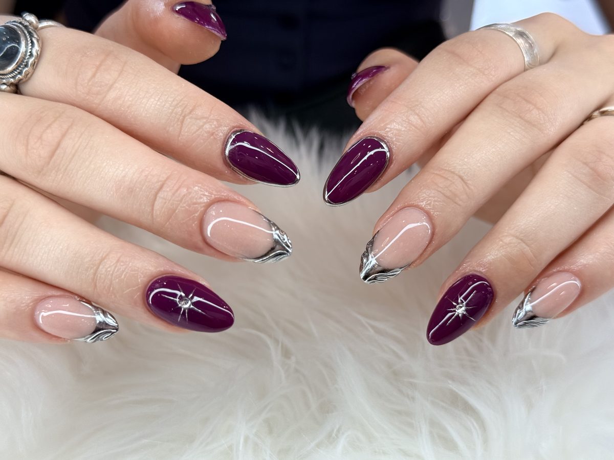 Almond nails in deep plum with silver chrome French outlines